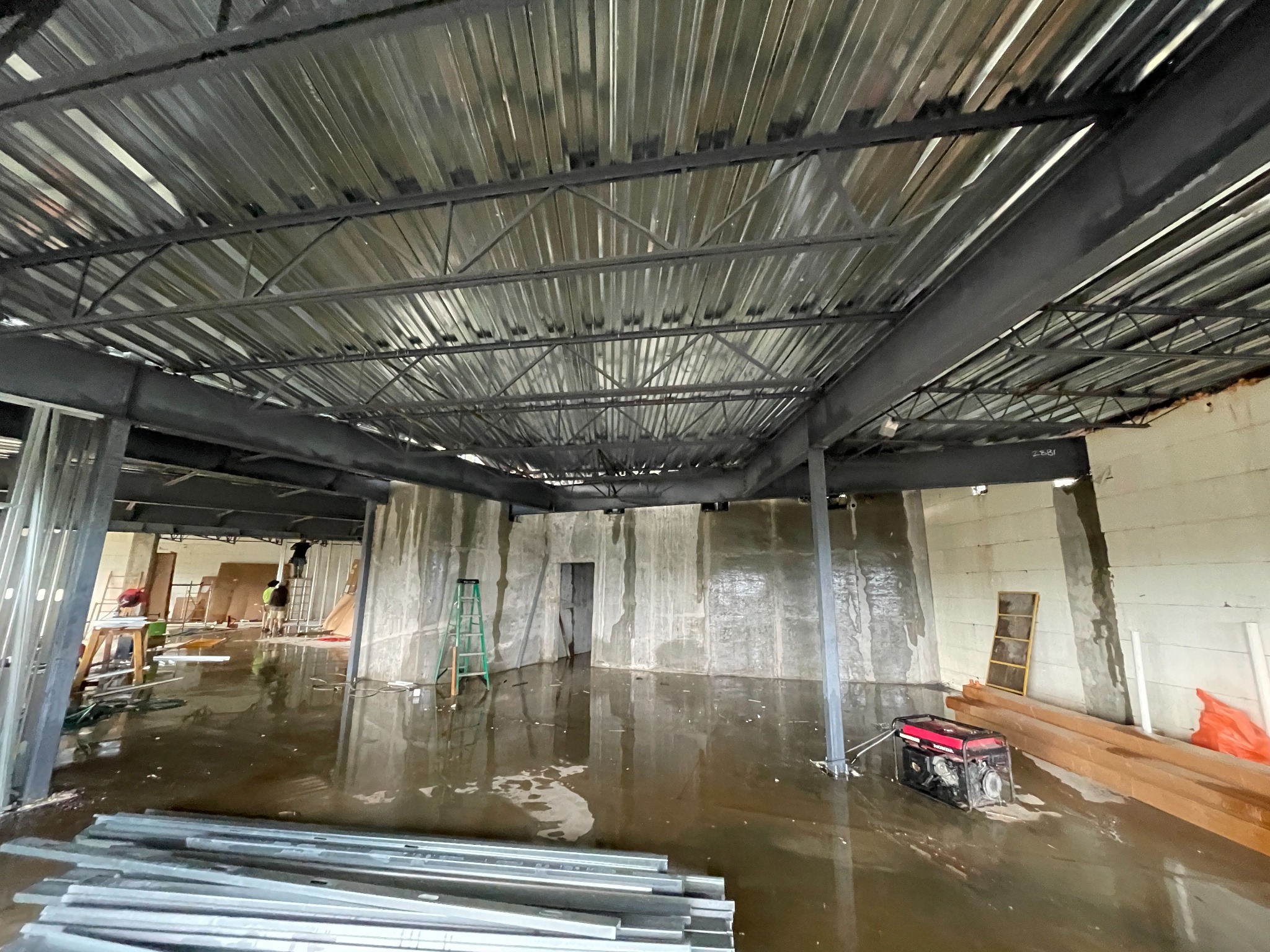 Interior structural steel framing and reinforced concrete walls during construction